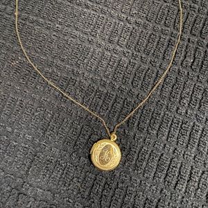 14K GF (gold filled) monogramed (K) locket with an 18 inch 14K GF chain.
